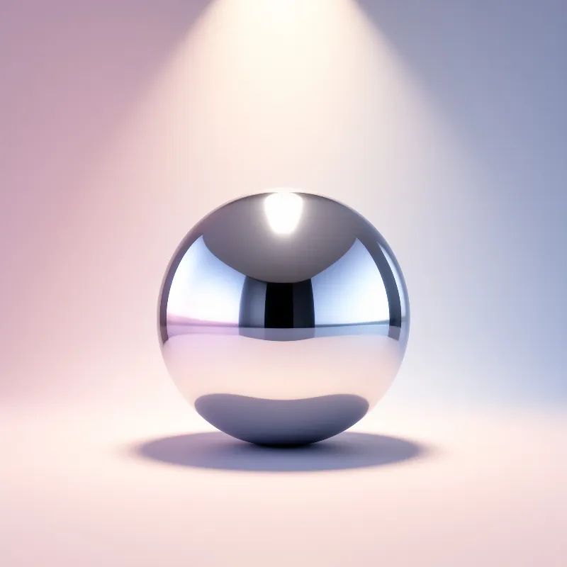 A highly reflective chrome sphere rests on a surface illuminated by a warm overhead spotlight casting soft shadows.