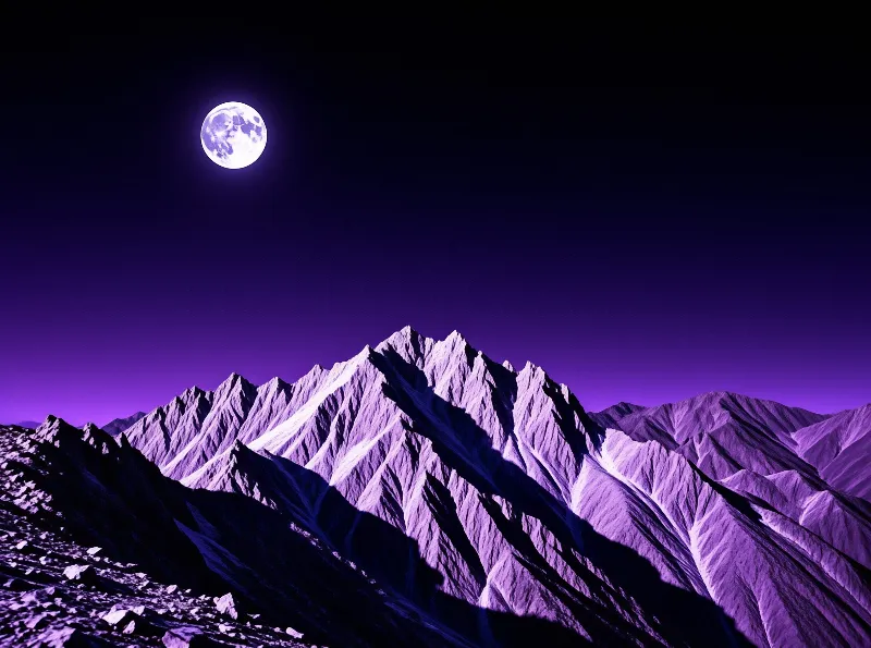 Jagged snow covered peaks rise sharply against a deep violet sky illuminated by a bright full moon.