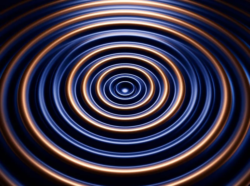 Alternating glowing copper and pale blue concentric rings recede into a dark vanishing point at the center of the frame.