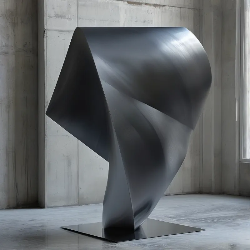 A large dark metallic sculpture stands on a base inside a room with concrete walls and bright light.