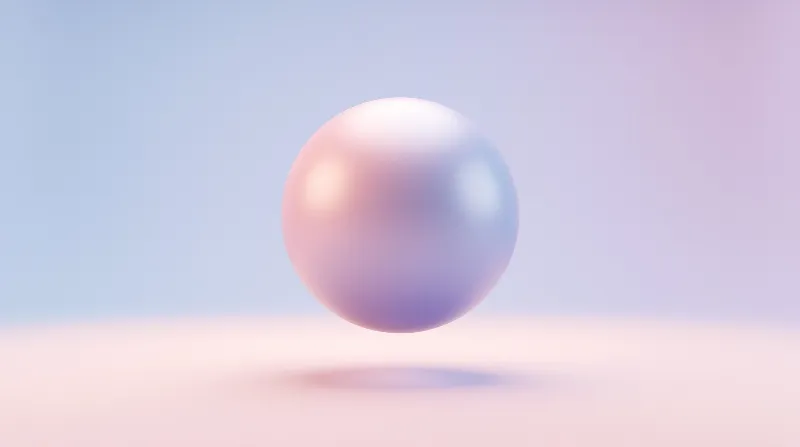 A smooth pearl-like sphere hovers in mid-air above a pale surface with a soft blue to pink gradient background.