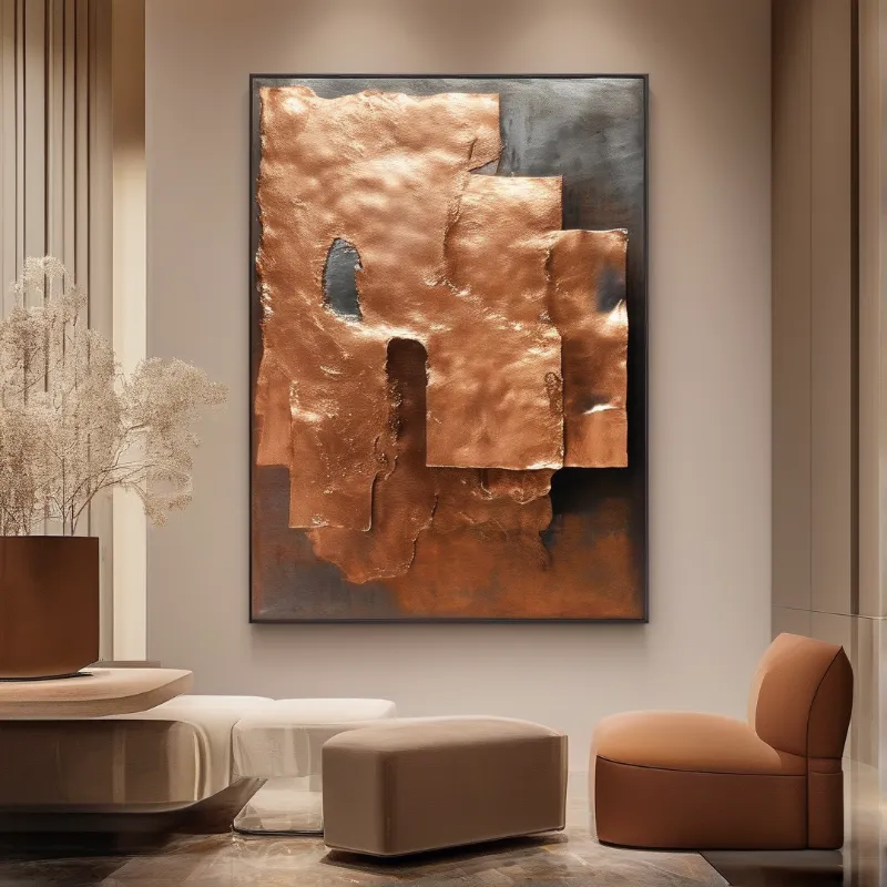 Copper abstract artwork hangs above beige seating and dried flowers in a warm minimalist interior space.
