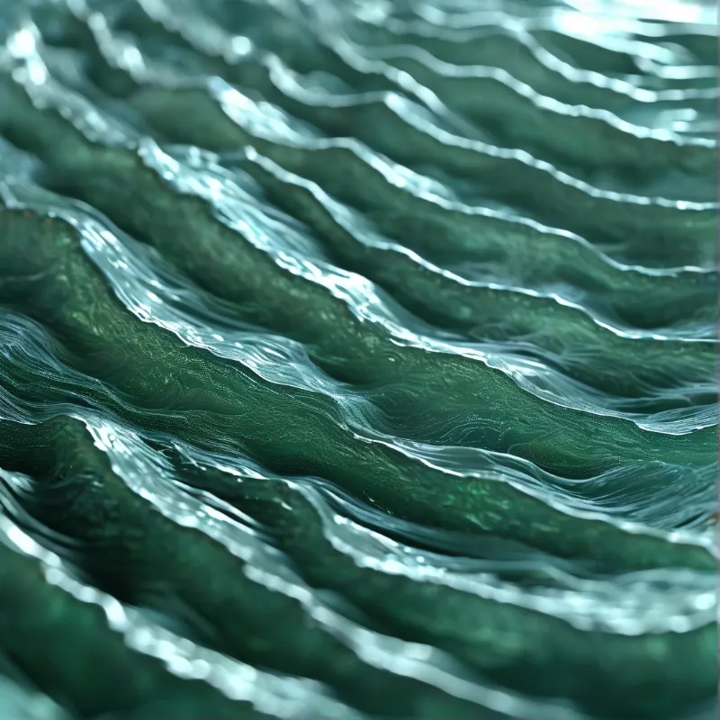 Sinuous green ridges catch silvery highlights as they ripple diagonally across the frame