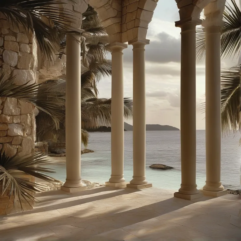 Pillars of smooth stone frame a tranquil sea view flanked by palm trees and casting long shadows onto the terrace.