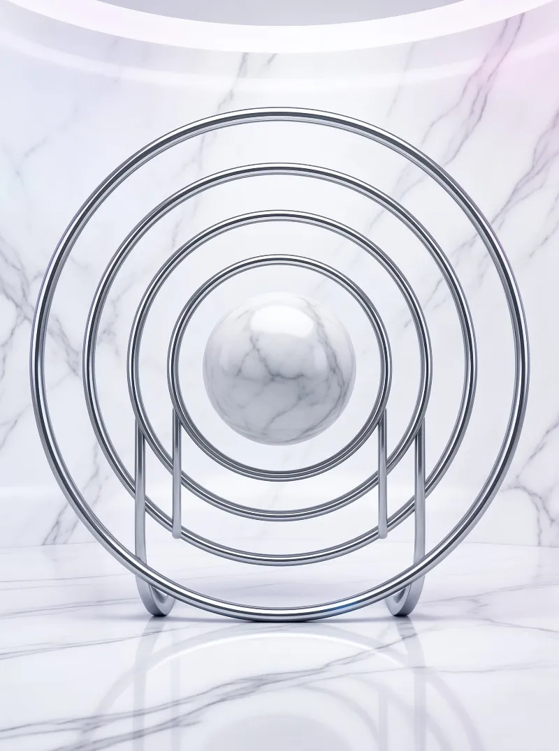 Polished chrome circles frame a suspended marble ball against a white stone wall and glossy reflective surface.