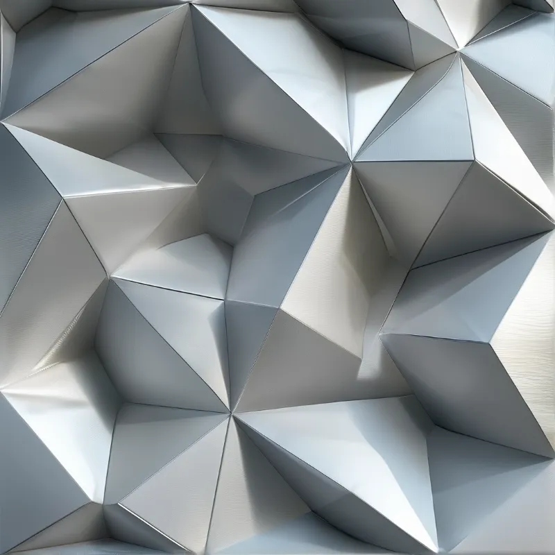 Close view of a silver geometric surface composed of interlocking polygonal faces creating a deep textured pattern with high contrast light.