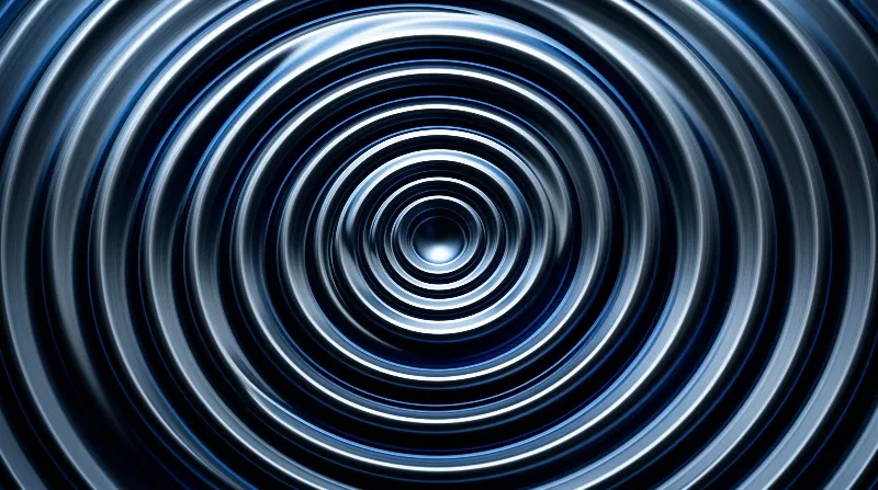 Concentric blue and white rings spiral towards a dark central void, creating a deep sense of motion and depth.