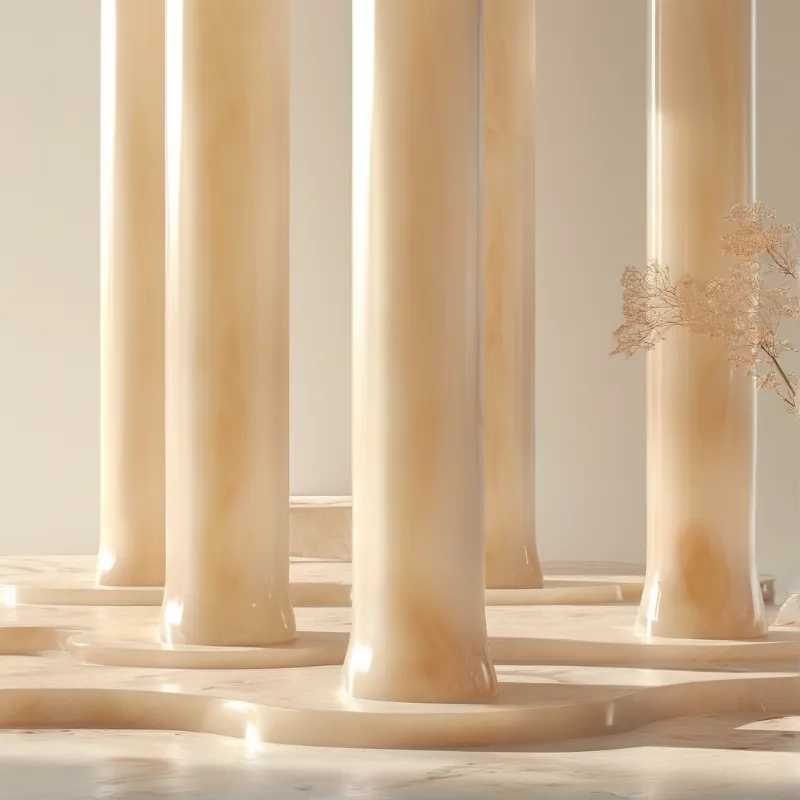 Several creamy pillars emerge from a wavy platform while dried flower sprigs accent the minimalist scene