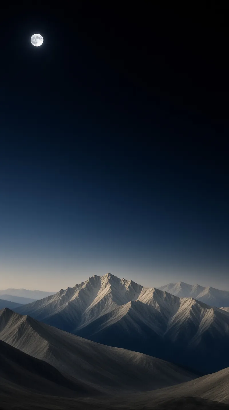 A bright full moon sits in the dark upper sky above layers of snow dusted jagged mountains under a fading blue gradient sky