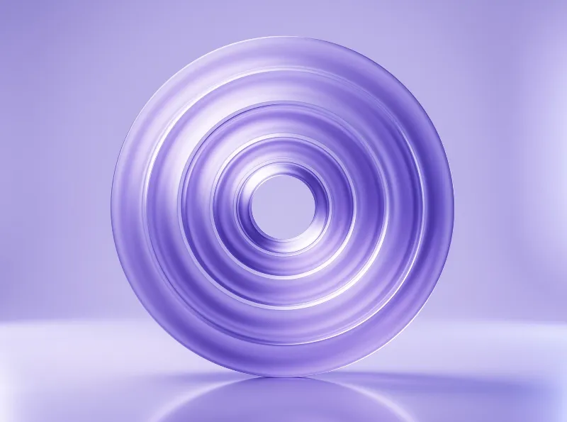 Layered violet rings form a conical shape resting on a smooth reflective surface with soft lighting.
