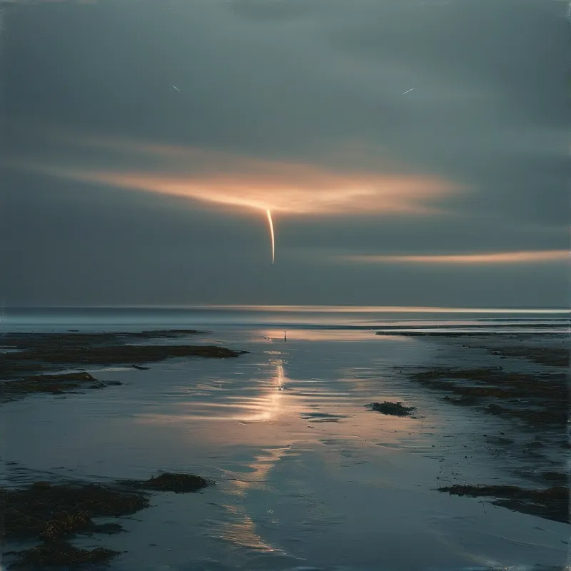 A warm glowing light shaft hangs over low tide coast, its soft reflection stretching across wet sand under muted dusk clouds.