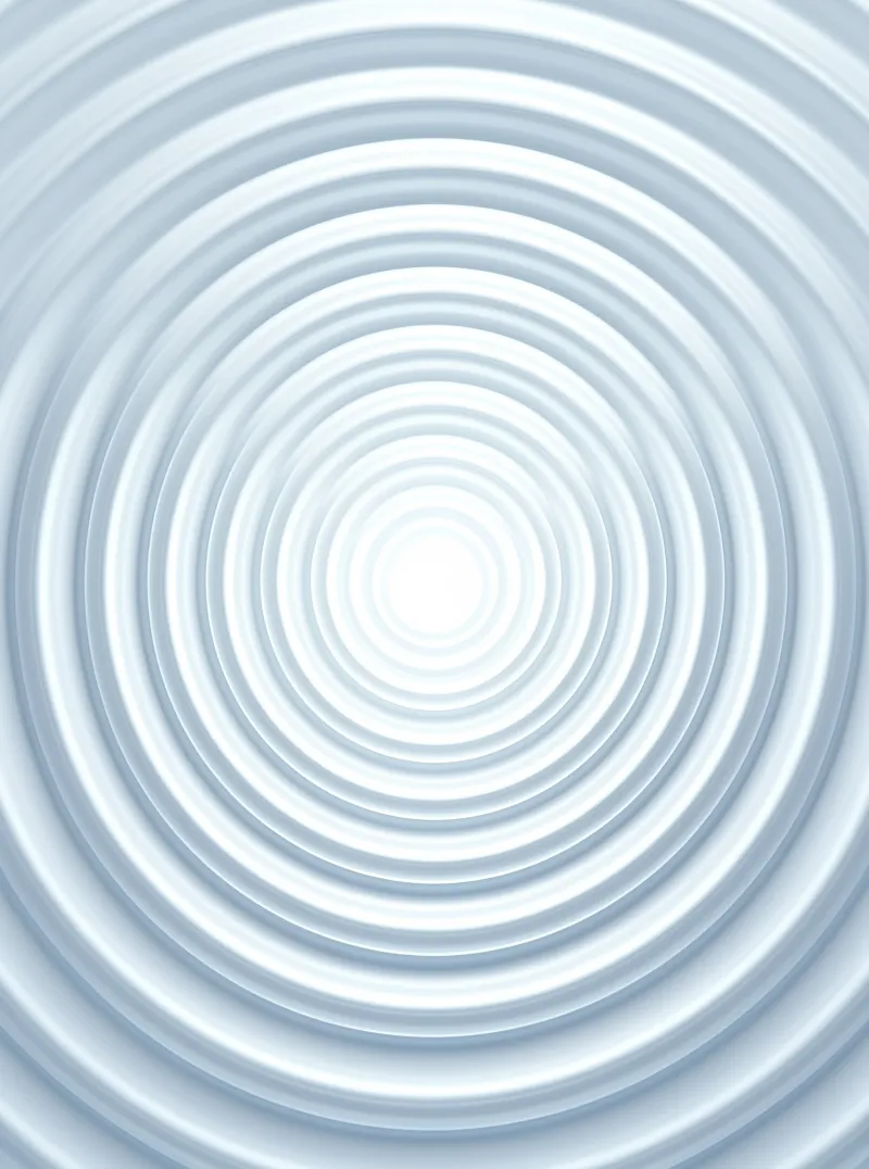 Light blue water ripples expand outwards from a bright white center to form concentric rings.