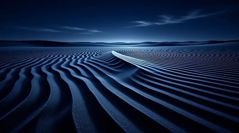 Blue sand dunes ripple across a vast landscape, forming a pattern leading to a bright glowing ridge on the horizon.