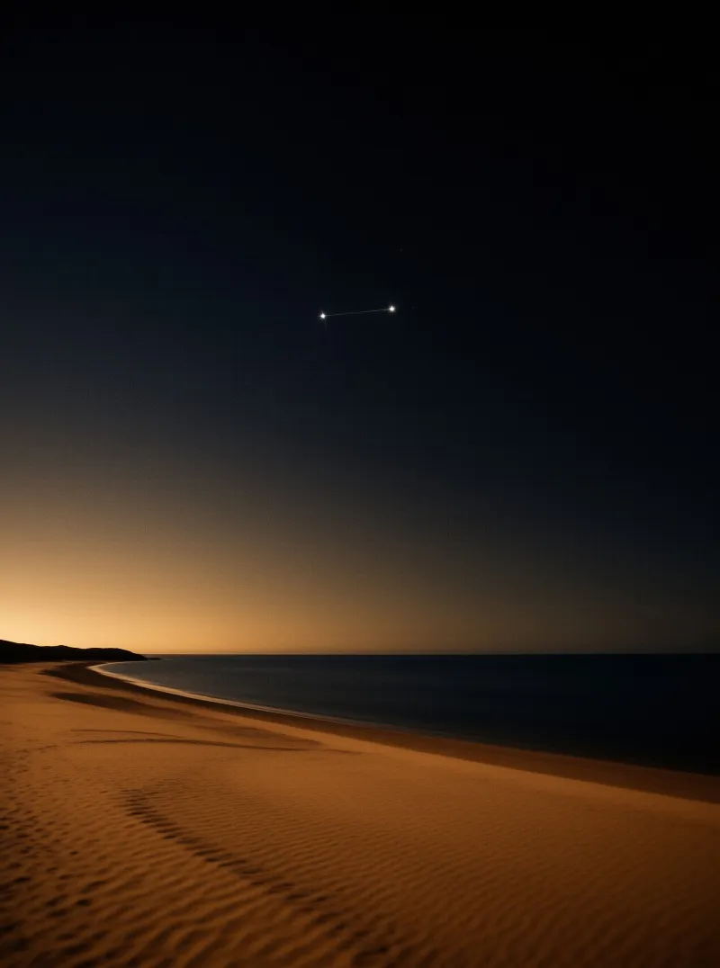 Two bright stars connected by a line hang in a dark sky above a calm ocean and an illuminated shoreline.
