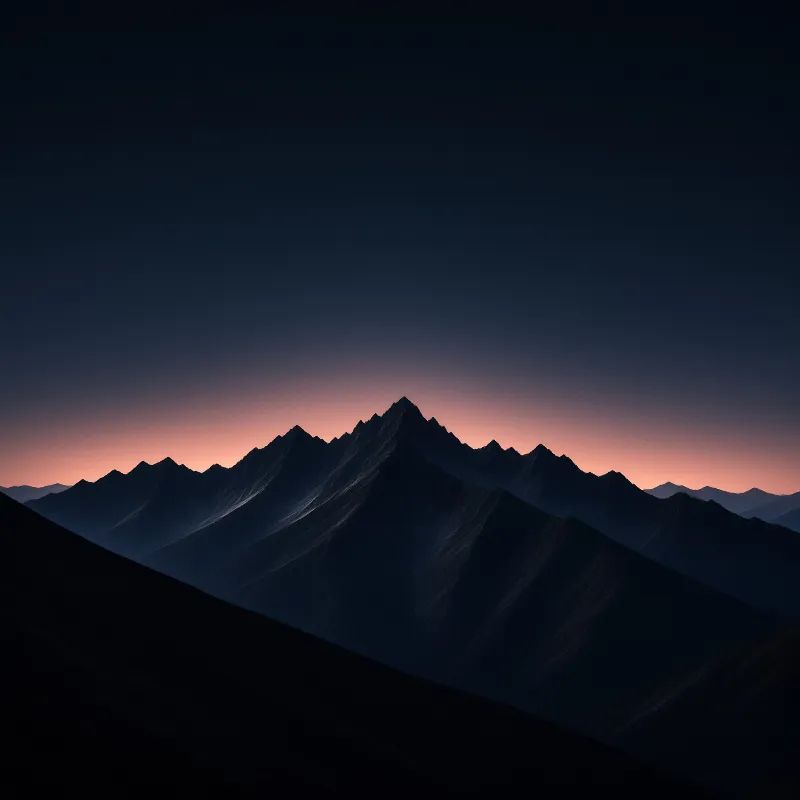 Dark jagged peaks rise against a gradient sky fading from deep blue to warm pink light.