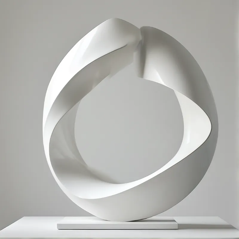 A single continuous band of glossy white material twists into an open ring, lit softly against a plain grey backdrop.
