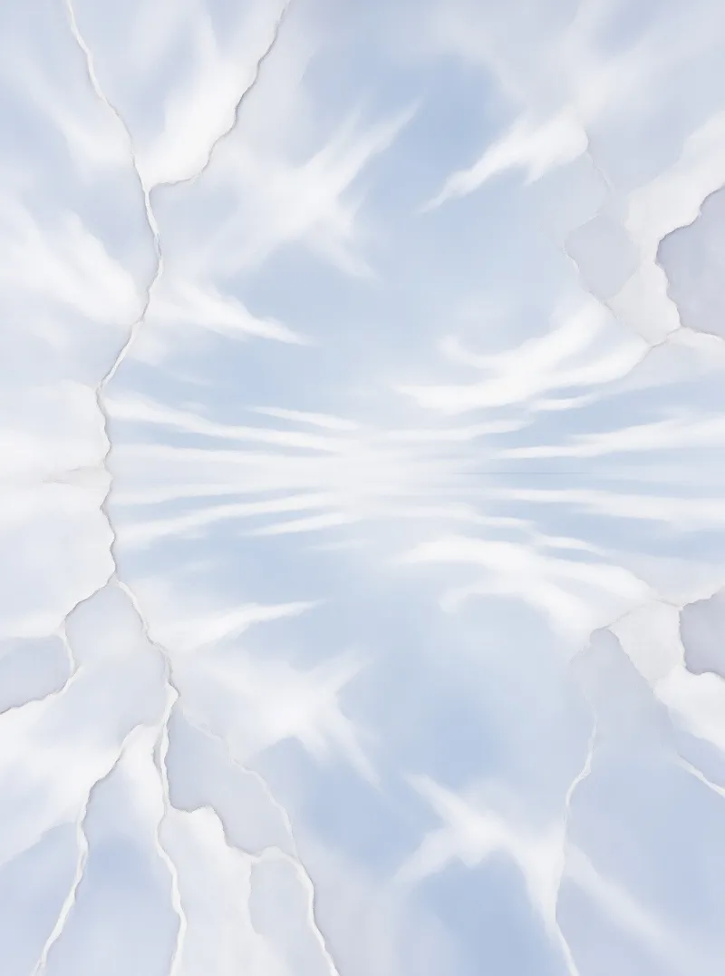 A cracked surface mirrors the soft blue sky and white wispy clouds, creating a symmetrical pattern of light and earth.