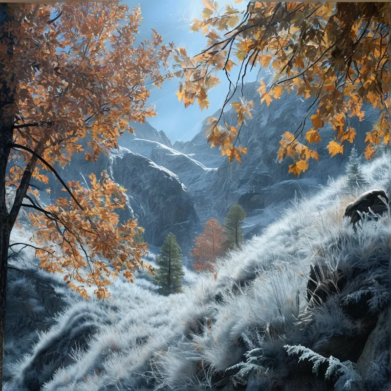 Orange maple leaves frame a frost covered valley of soft sunlight lit snow dusted rocky mountains and frosted grass