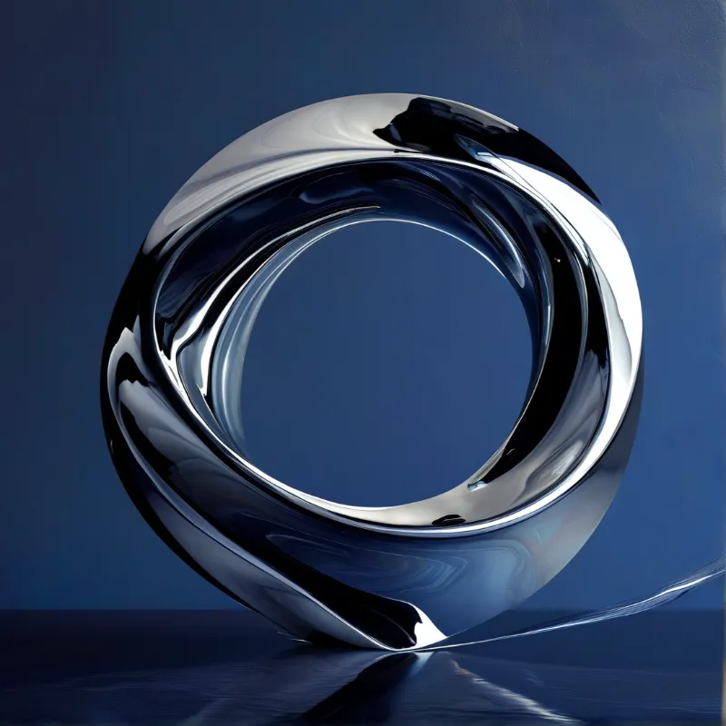 A highly reflective metallic torus rests on a dark blue surface with sharp white highlights.