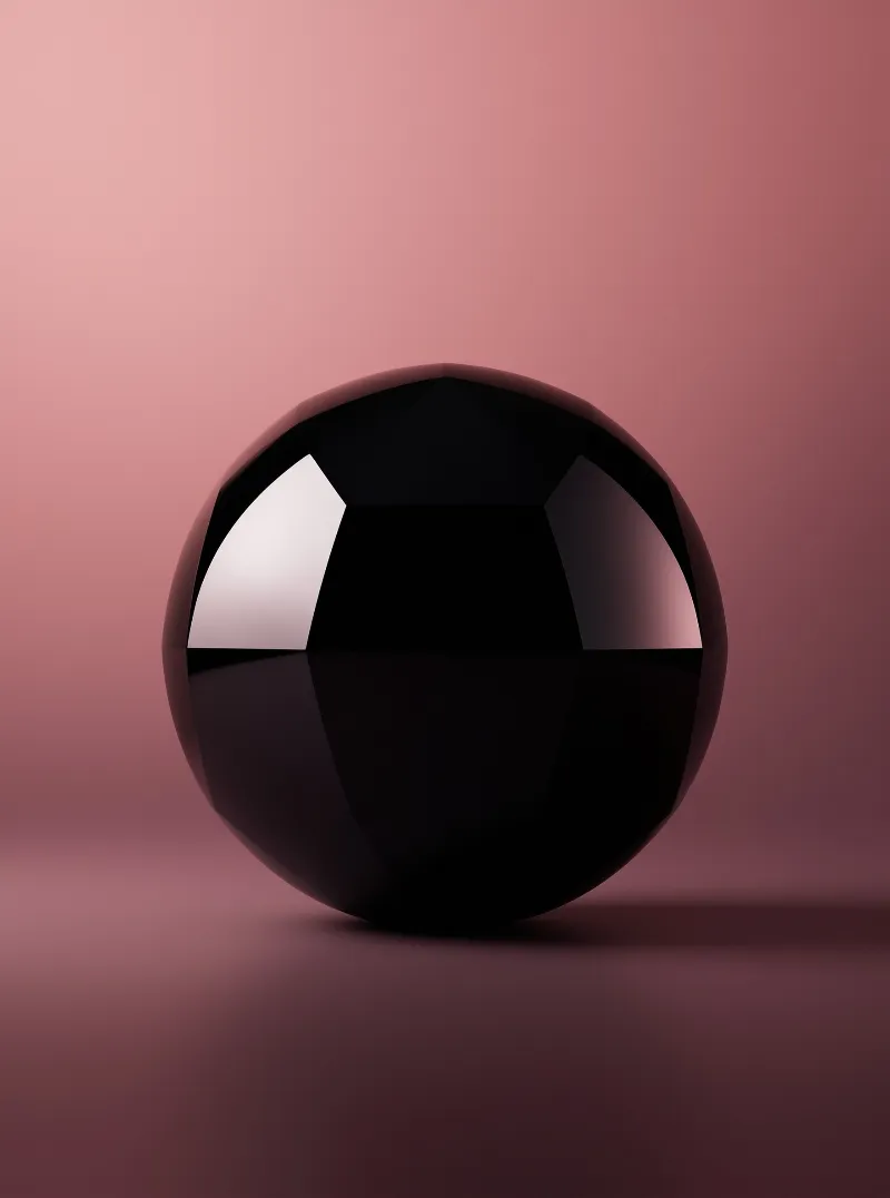 A glossy black sphere rests against a gradient pink background showing sharp white reflections on its curved surface.