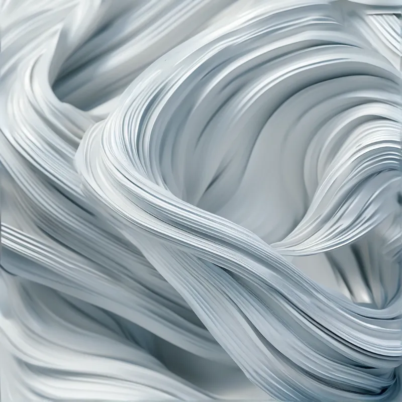 Glossy white and pale grey strands curl and overlap in a smooth abstract composition of flowing ribbons.