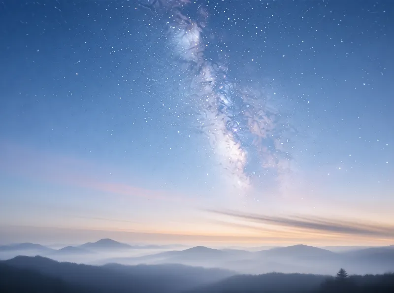 Milky Way Over Misty Peaks