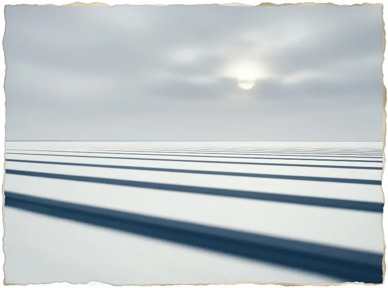 Parallel dark shadows cross a vast white landscape under a pale sky with a diffused sun.