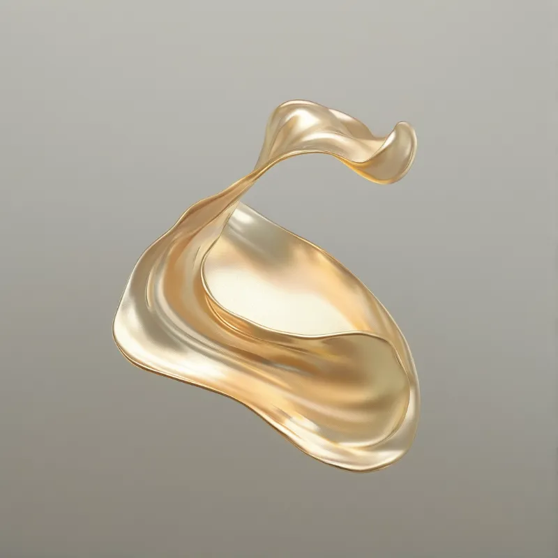 A glossy gold liquid shape curves gracefully against a matte grey surface reflecting soft studio illumination