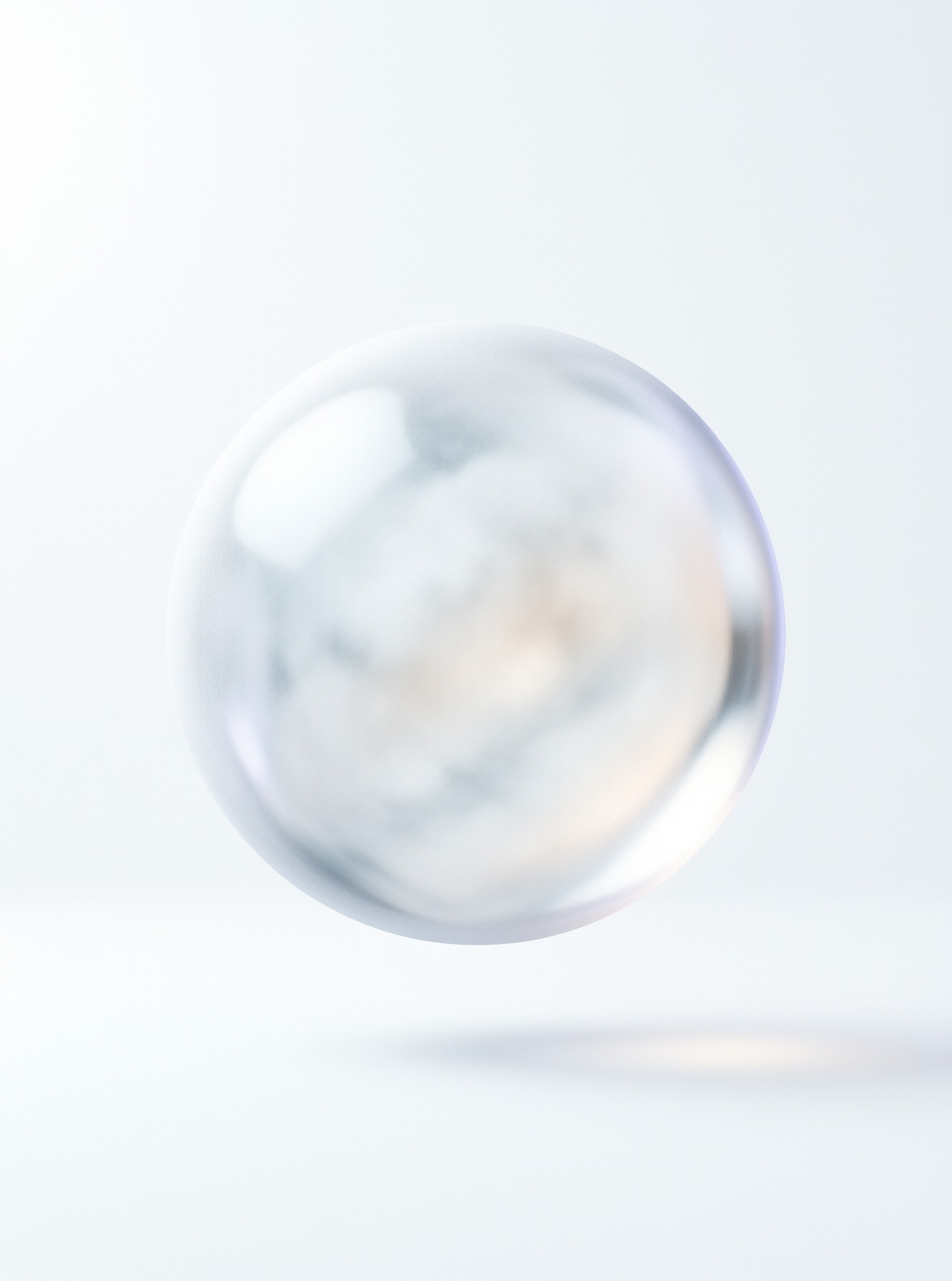 A clear bubble hovers above a white plane showing internal color shifts.