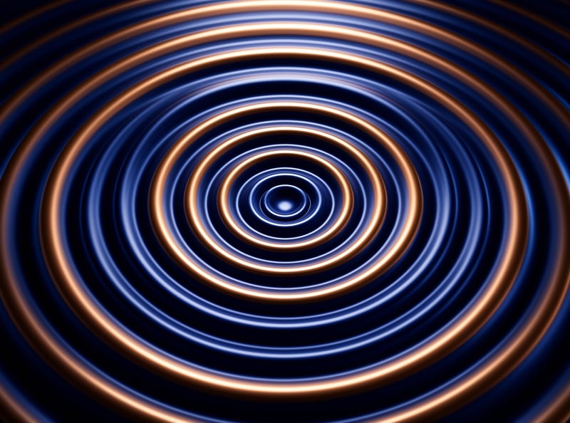 Alternating glowing copper and pale blue concentric rings recede into a dark vanishing point at the center of the frame.