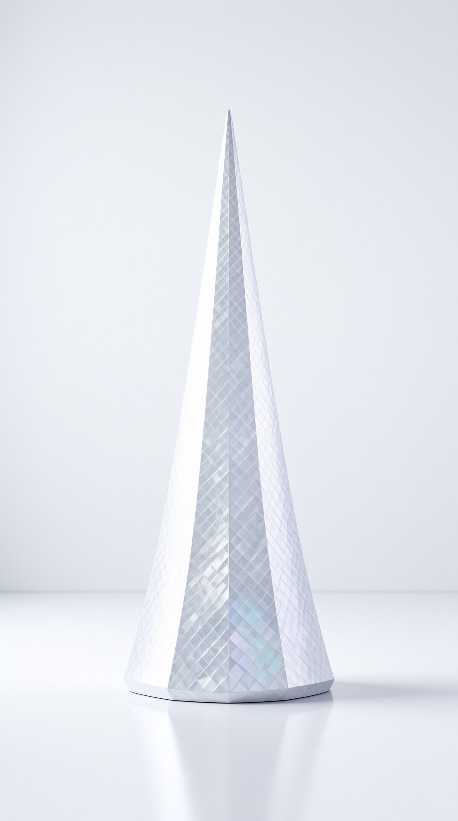 A tall white pyramidal sculpture with a diamond grid texture stands centered on a glossy floor reflecting its base.