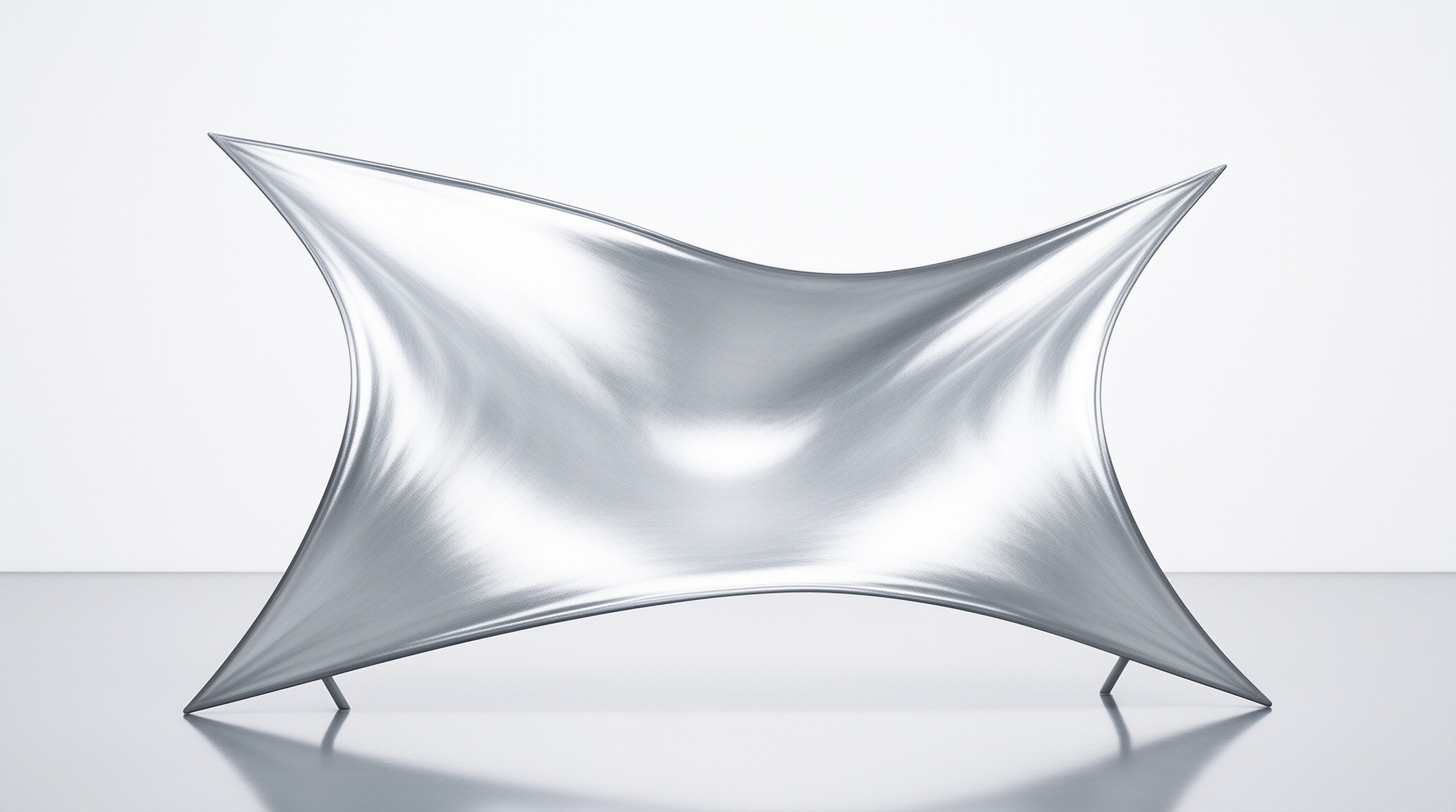 A sleek reflective metallic sculpture stands on a glossy white floor its curved form catching soft studio lighting