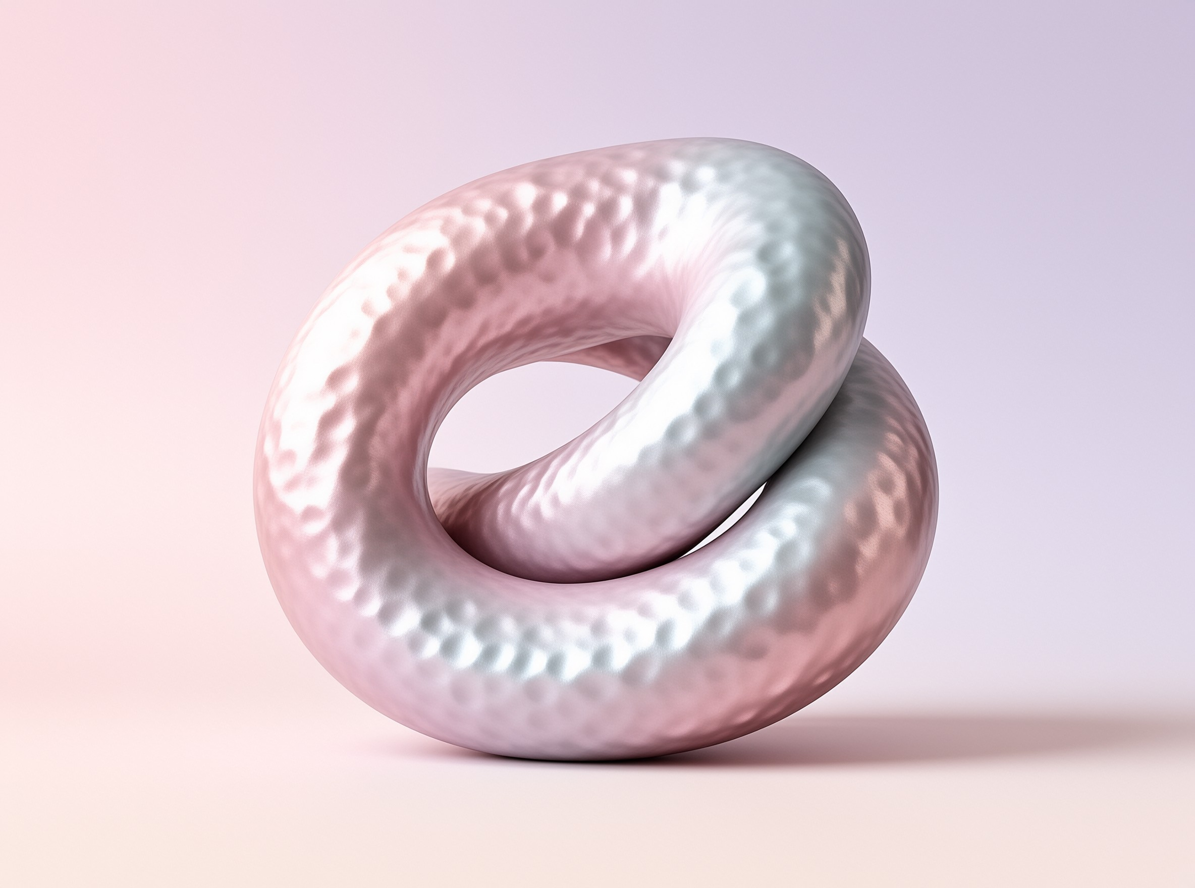 A dimpled satin loop twists into a soft pink and silver knot against a gentle pastel gradient