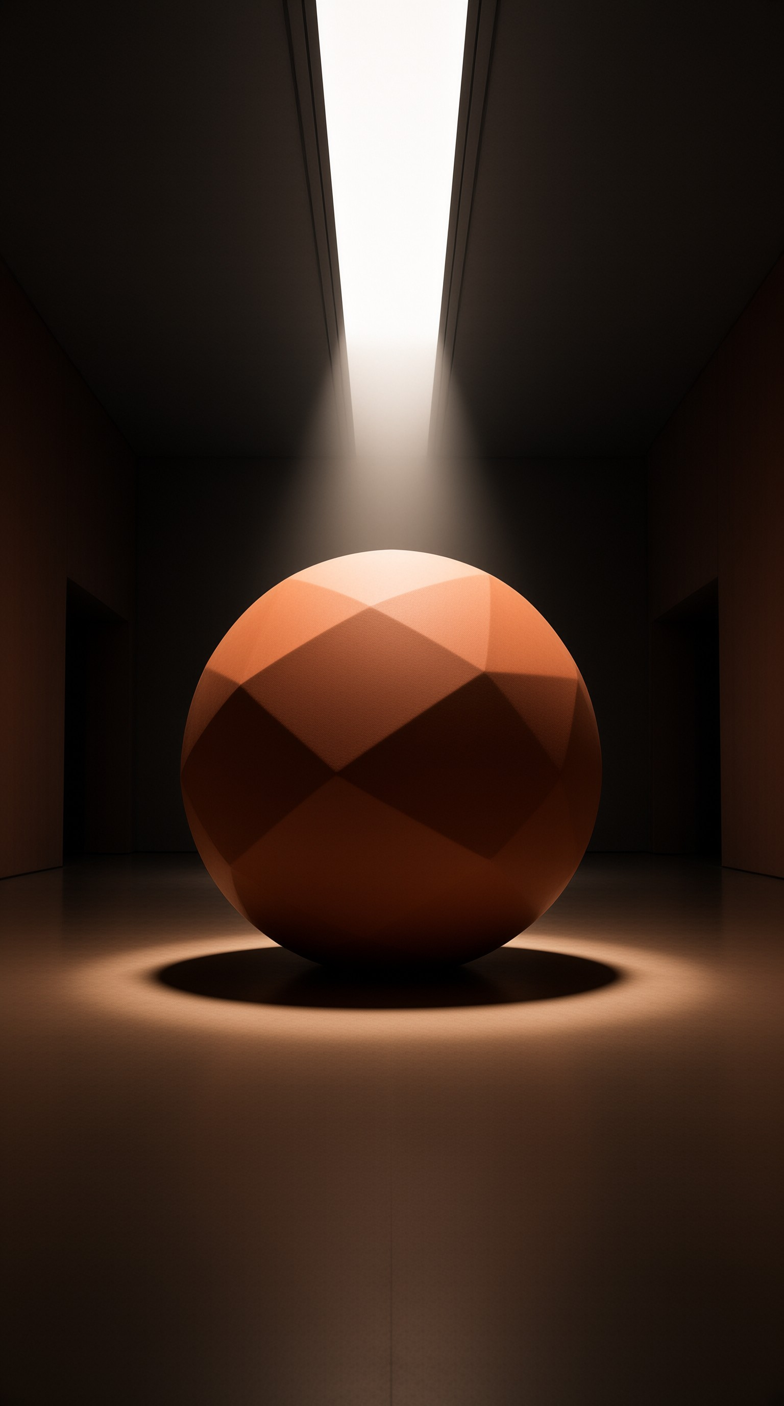 A large orange polyhedral object rests on a dark floor beneath a strong vertical beam of white light.