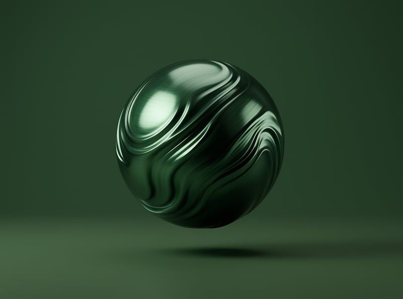 A reflective green sphere with swirling marbled textures hovers above a dark surface under soft directional lighting.