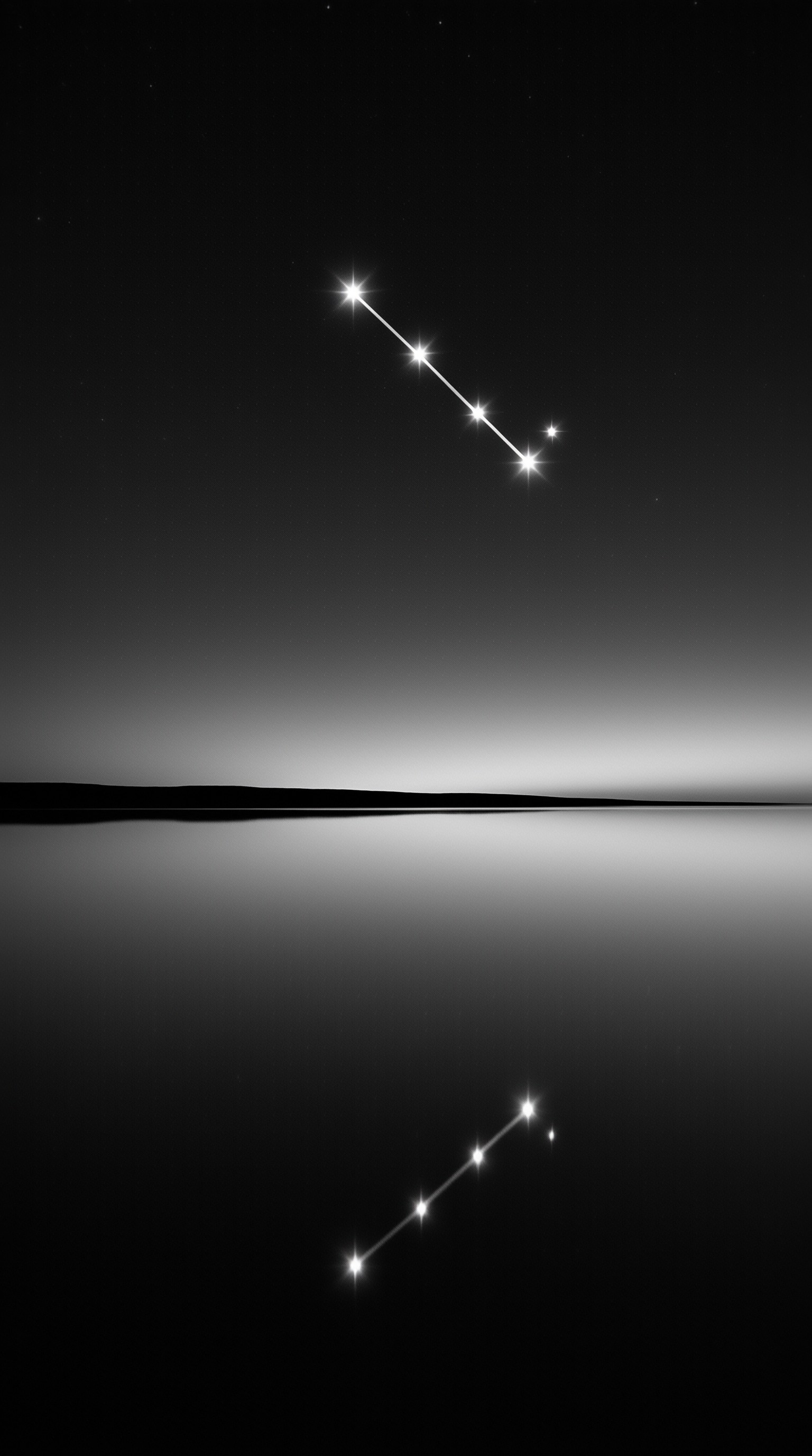 A black and white image displays a diagonal arrangement of bright stars connected by lines in the sky, mirrored exactly in the dark reflective surface below a thin horizon line.