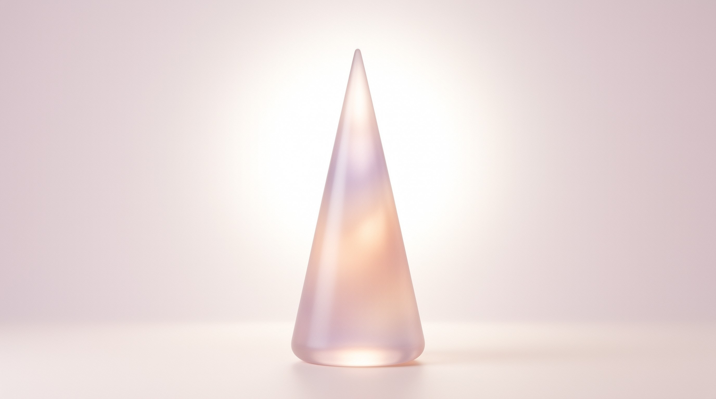 A smooth translucent crystal cone glows softly against a pale pink studio background with diffused lighting.