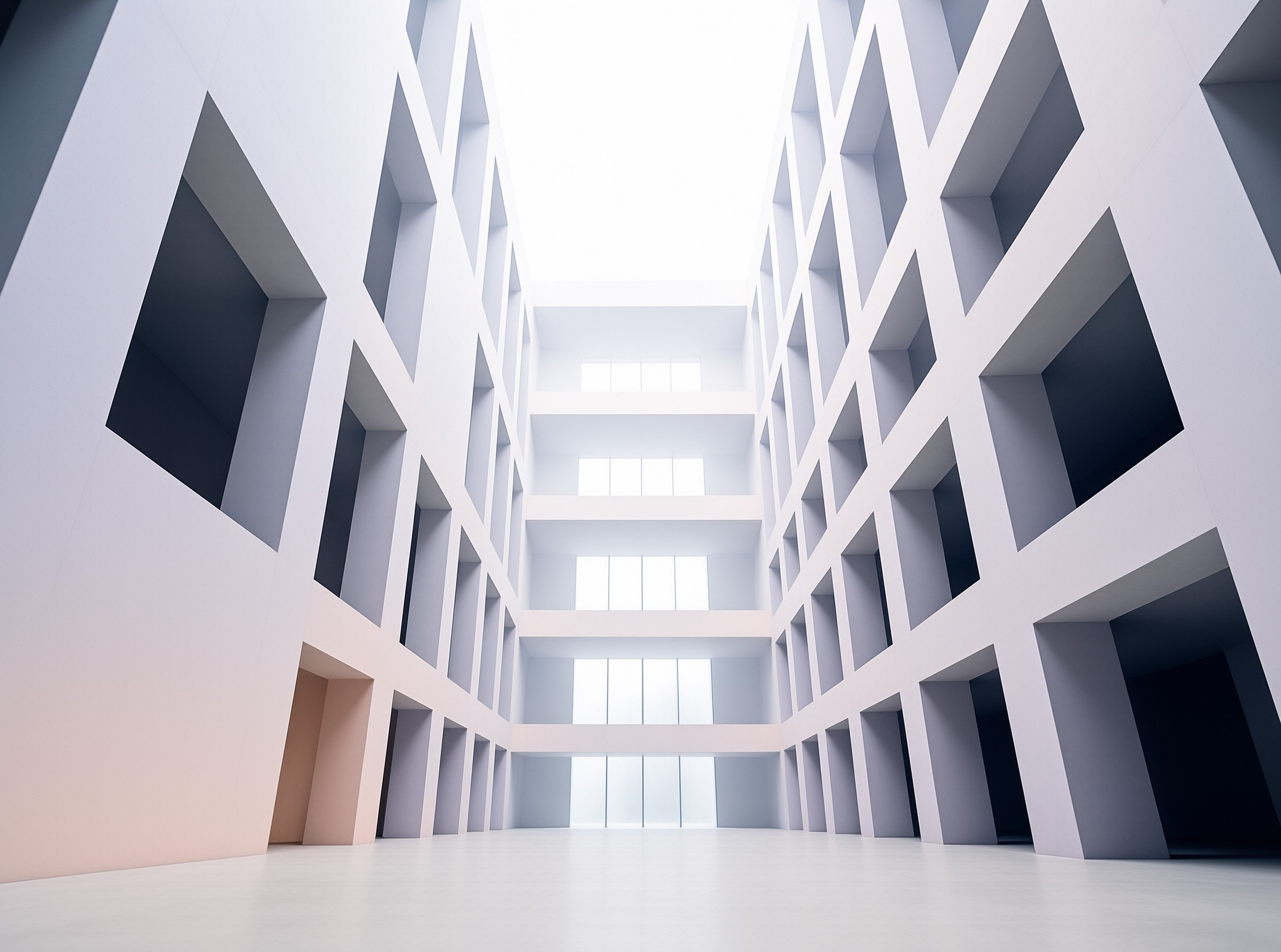 A bright minimalist white atrium rises in tiers, its walls carved with a grid of deep square recesses and tall windows