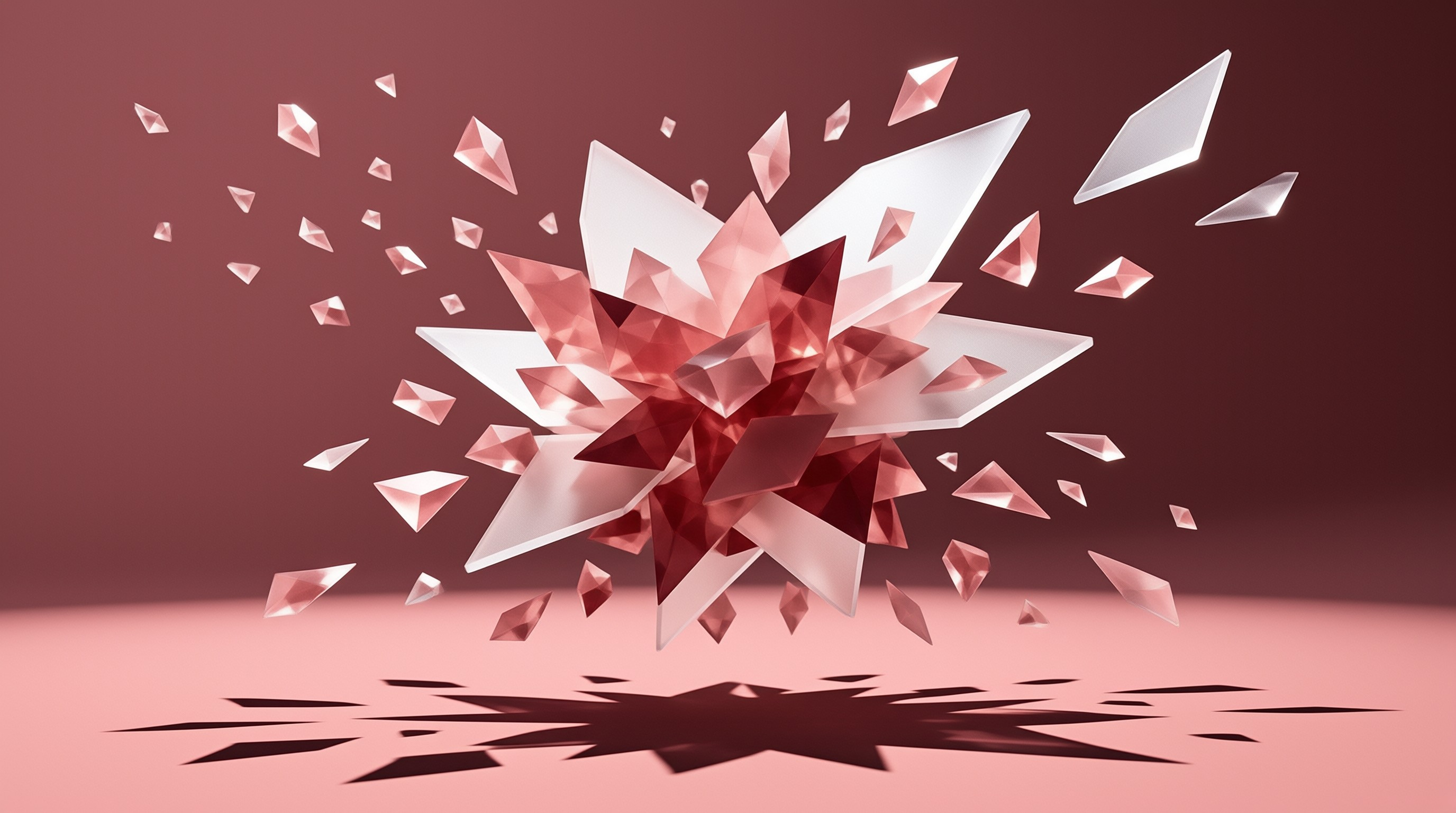 A burst of pink and white crystal fragments freezes in motion above a flat surface casting dark angular shadows.