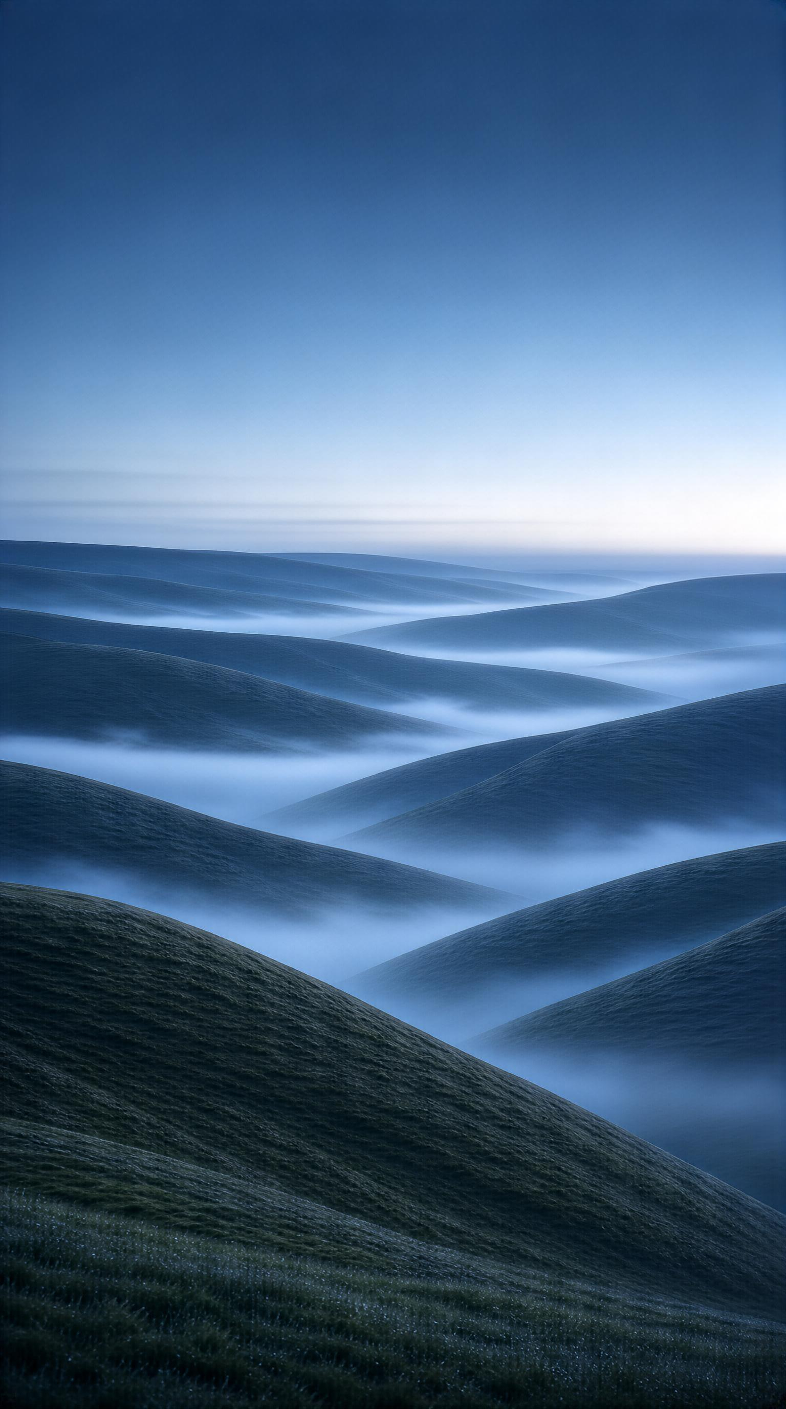 Misty Rolling Hills at Dawn
